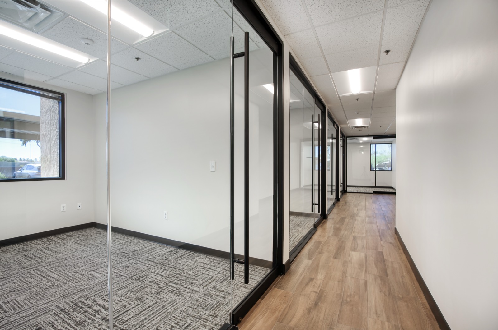 Glass-front offices along corridor — tenant improvement in Phoenix by JMG Contracting